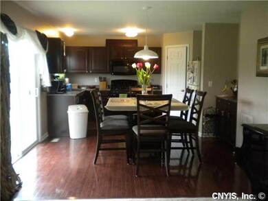 Kitchen. The eat-in kitchen boasts gleaming hardwo
