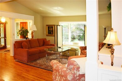 Great Room with Hardwood Flooring and Cathedral Ce