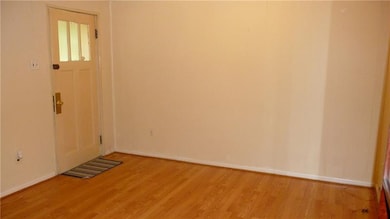 Living room has nice floors and fresh paint