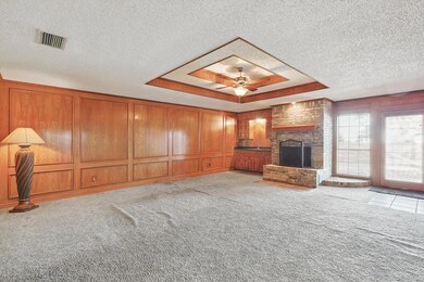 Tiled foyer entrance with a textured ceiling