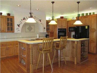 Open floor plan with 12'ceilings, custom maple cab