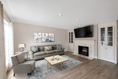Great living room space with a fireplace, and cust