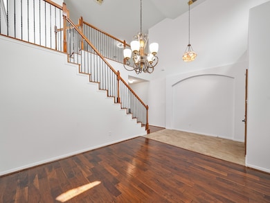 Step inside to a soaring foyer where natural light