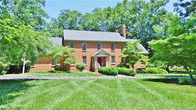 Well landscaped, mature trees, cobblestone lined c