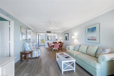 Living area featuring ceiling fan with notable cha