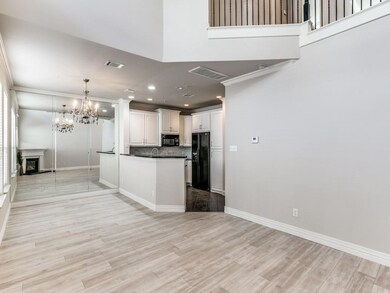 Kitchen featuring a notable chandelier, open floor