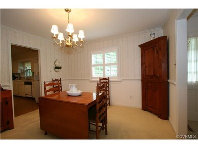 Dining room features double window with plantation