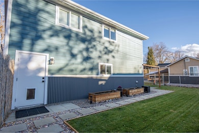 Side view of property with a patio