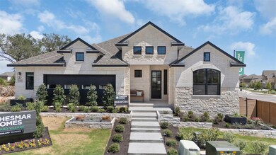 French country home featuring stone siding, a shi
