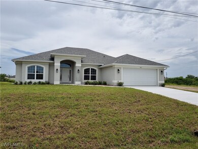 View of front of property featuring a garage and a