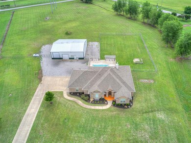 Birds eye view of property featuring a rural view