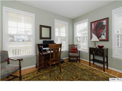 Formal living room has hard wood floors.