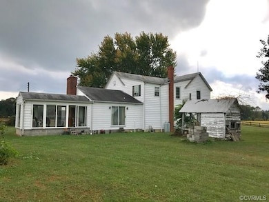 Rear photo of Farmhouse & utility shed. (Shed need