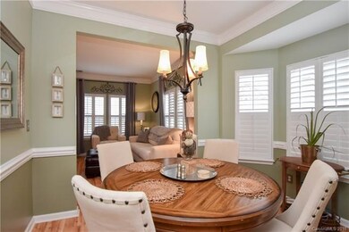Dining Room with Chair Railing, hardwood floors, a