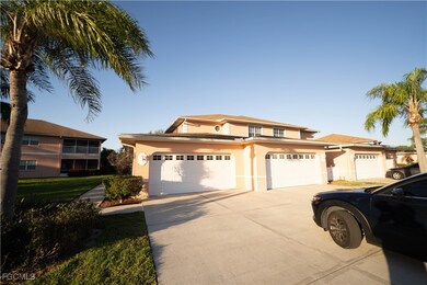 Traditional-style house featuring stucco siding, driveway, and an attached garage