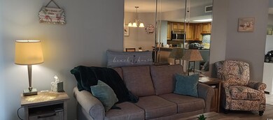 Living room featuring an inviting chandelier