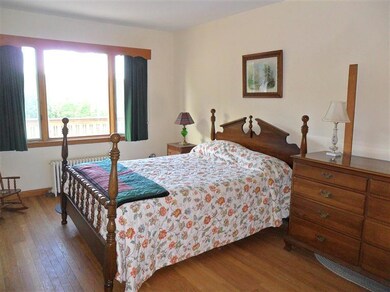 Bright first floor bedroom with oak floor.