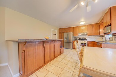 The completely remodeled Kitchen features custom c