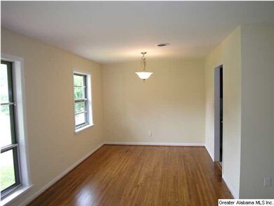 Formal dining room with gleaming hardwood floors