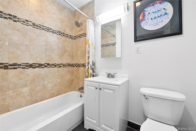 Bathroom with vanity and shower / bath combo