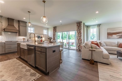 This open floor plan is the perfect combination of luxury and practicality! HOME IS UNDER CONSTRUCTION - Photo is from builder's library and shown as an example only (colors, features and options will vary).