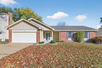 Ranch-style home featuring brick siding, driveway, an attached garage, and a shingled roof