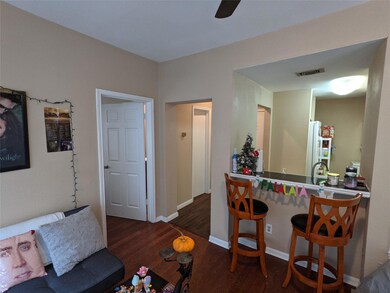 Living room featuring wood finished floors, ceili