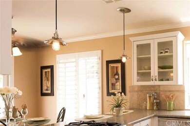 Custom pendant lights add elegance to the breakfas