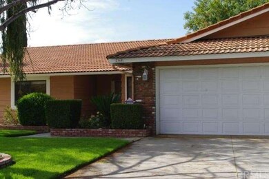 ATTRACTIVE BRICK PLANTER AT ENTRY
