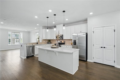 Kitchen features, modern cabinetry, and canned lig