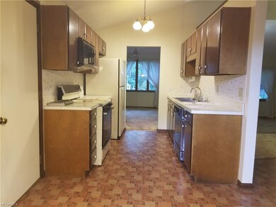 Opposite view through kitchen into dining room. Ga