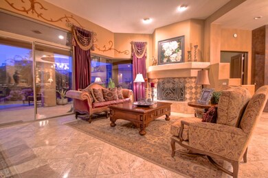 LIVING RM W/FIREPLACE AND OPEN TO POOL