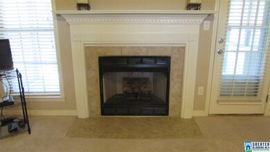 Tile surround the ventless gas fireplace.