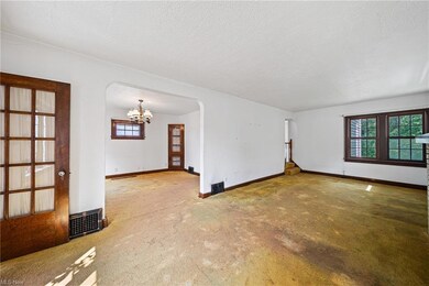 Carpeted empty room featuring a textured ceiling