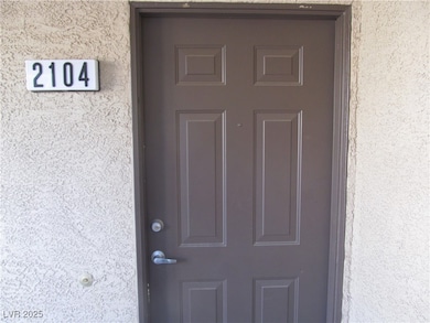 Property entrance with stucco siding