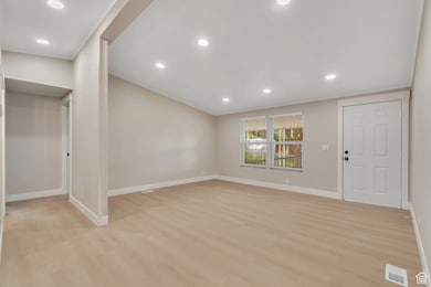 Entryway with recessed lighting and light wood-type flooring