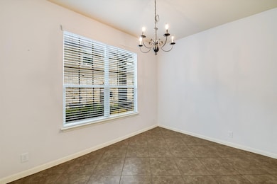 Spare room featuring a chandelier, healthy amount