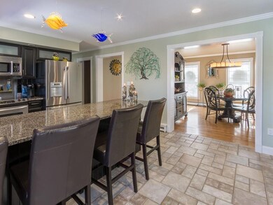 Granite island in kitchen with...