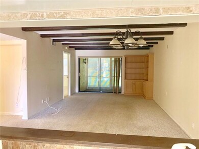Looking from the kitchen pass through to the livin