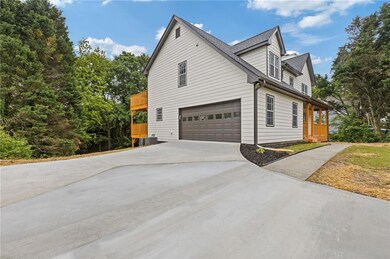 View of side of property with an attached garage, 