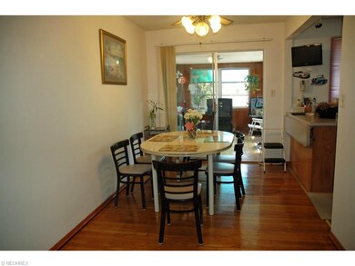 Formal Dining Room with Refinished Wood Floor, Slider Access To Three Season Sun room