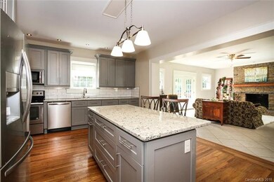 Huge kitchen is open to living and dining areas an