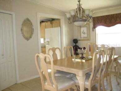 LARGE DINING AREA AND ADJACENT KITCHEN