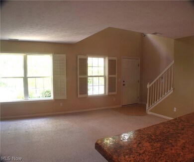 View of Open and Airy Great Room from the kitchen.