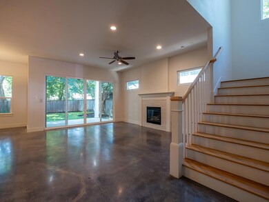Unfurnished living room with concrete flooring, r