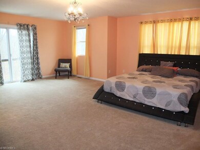 Spacious 22x19 master suite with sitting area and 
