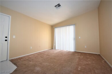 Empty room with visible vents, baseboards, carpet,
