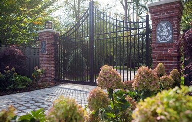 Merrillton's main gate with private drive to estat