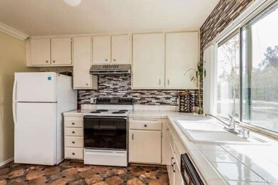 Updated kitchen with tiled counter tops, custom ti