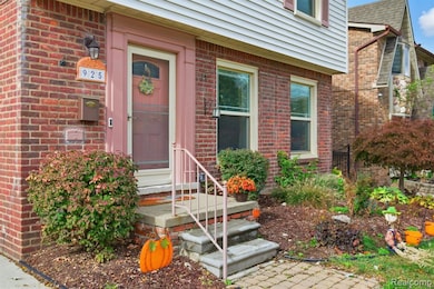 Doorway to property featuring brick siding and roof with shingles